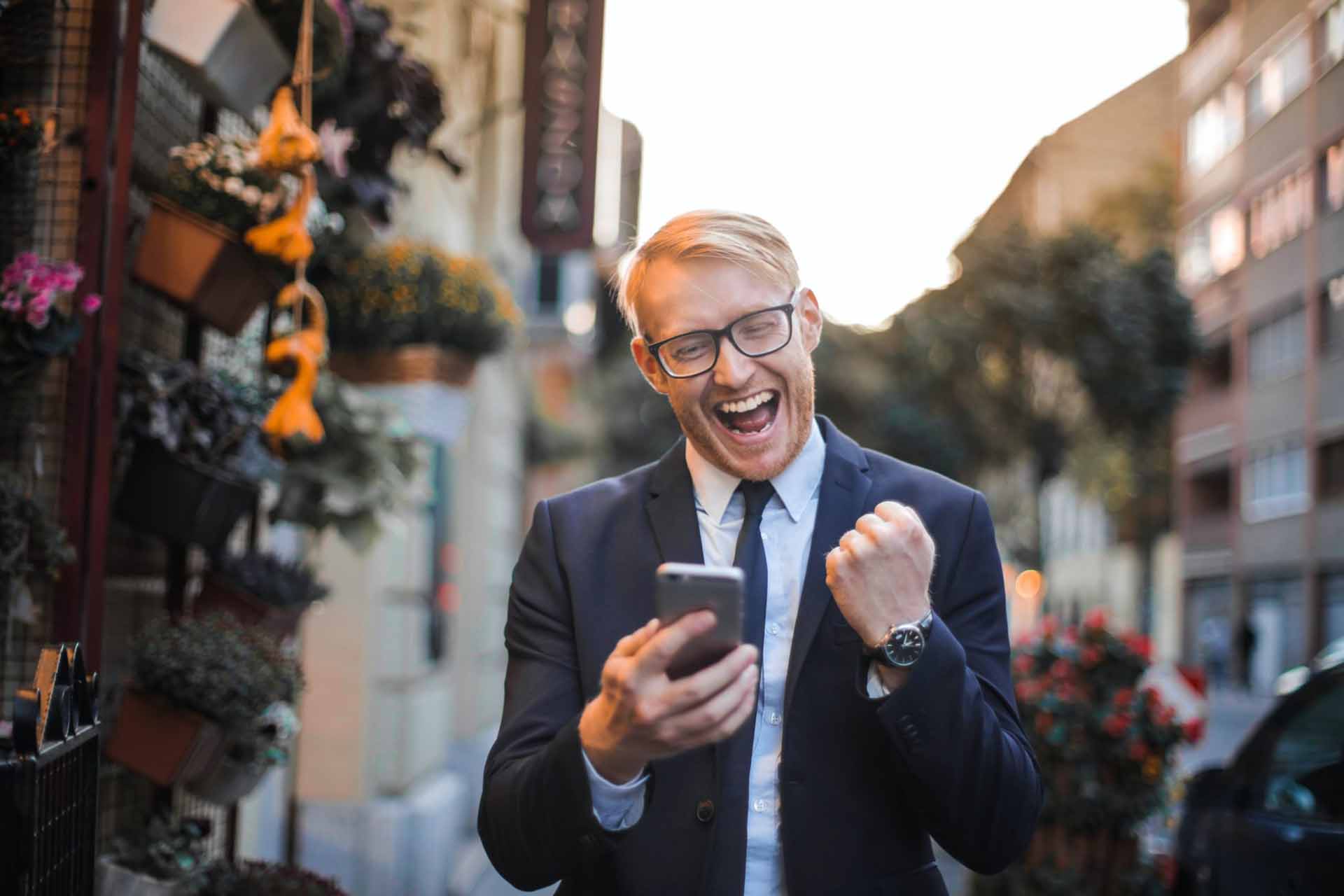 Man In Black Suit Jacket Received A Good News